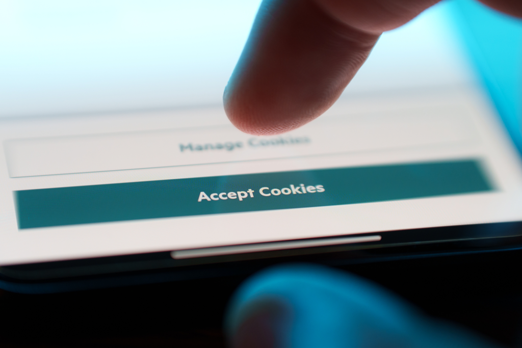 Finger choosing between Manage Cookies and Accept Cookies