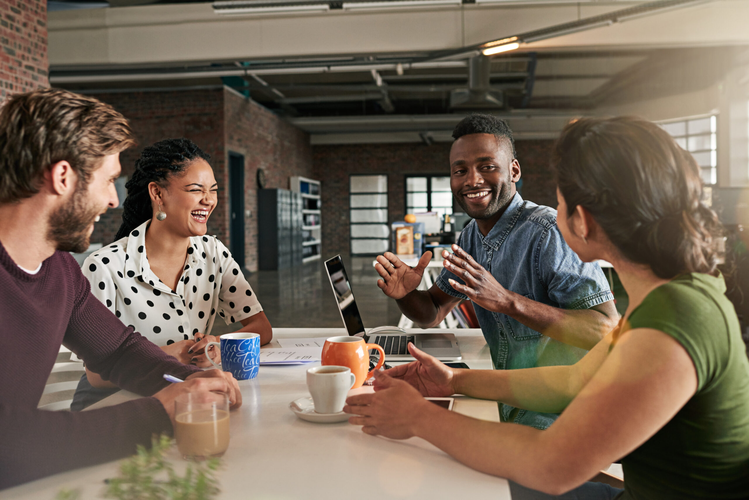 Image of a team of colleagues having a meeting in a modern office.