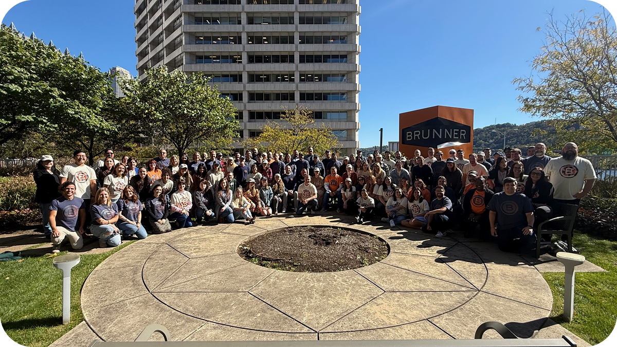 Group picture of Brunner employees outside of the Brunner office.