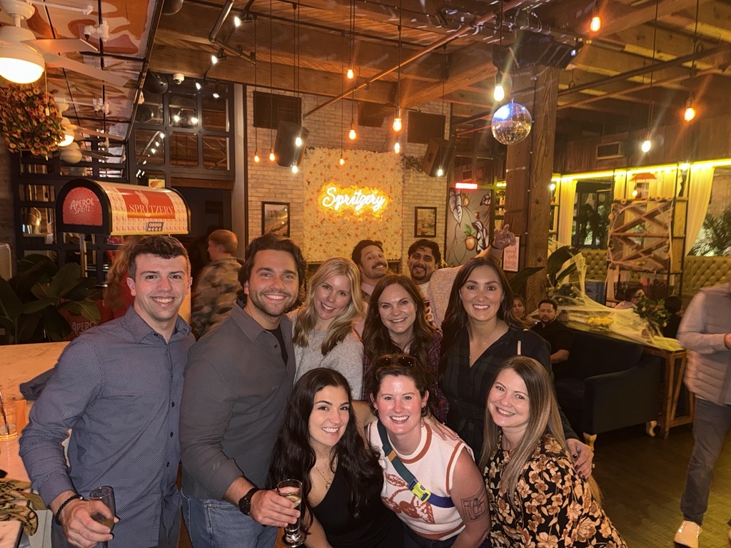 Brunner employees in a restaurant posing for a group photo