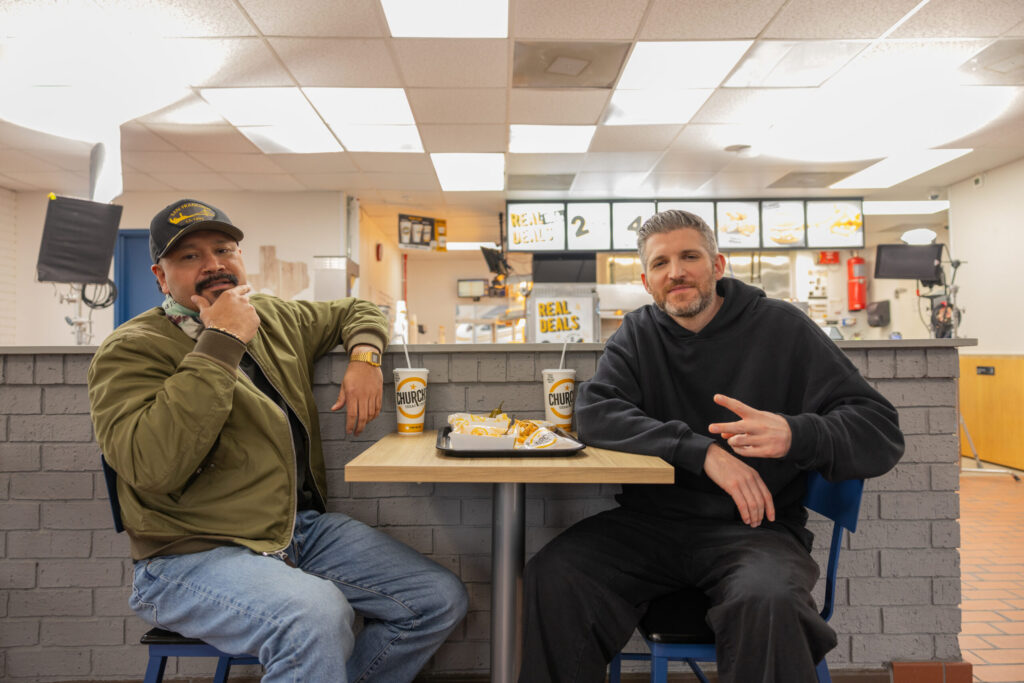 Harry Mack sitting at booth in Church's Taxas Chicken