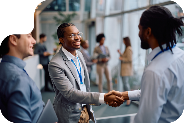 Two Businessmen Handshaking At A Professional Event