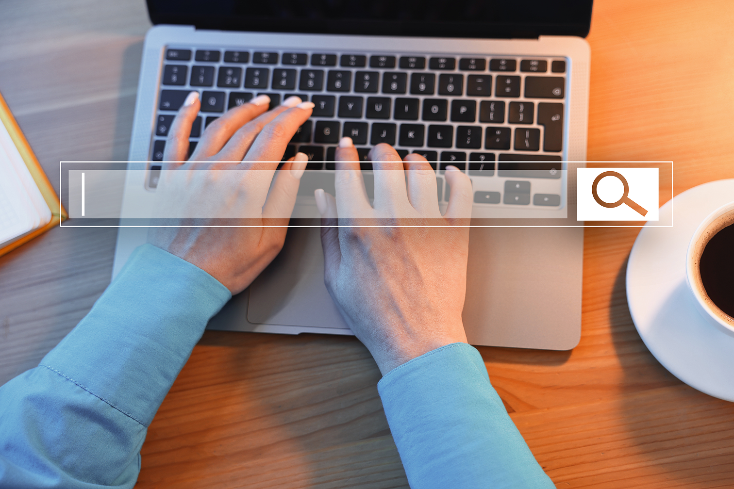 A person typing on a laptop
