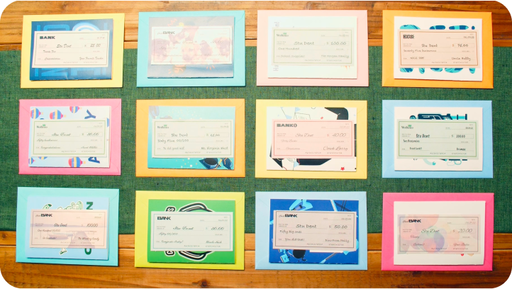 A grid of checks that are on top of cards with an envelope under the cards