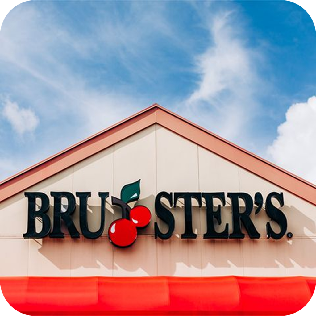 Front of a Bruster's Ice Cream store with the Bruster's sign and there is two cherries between the U and the S
