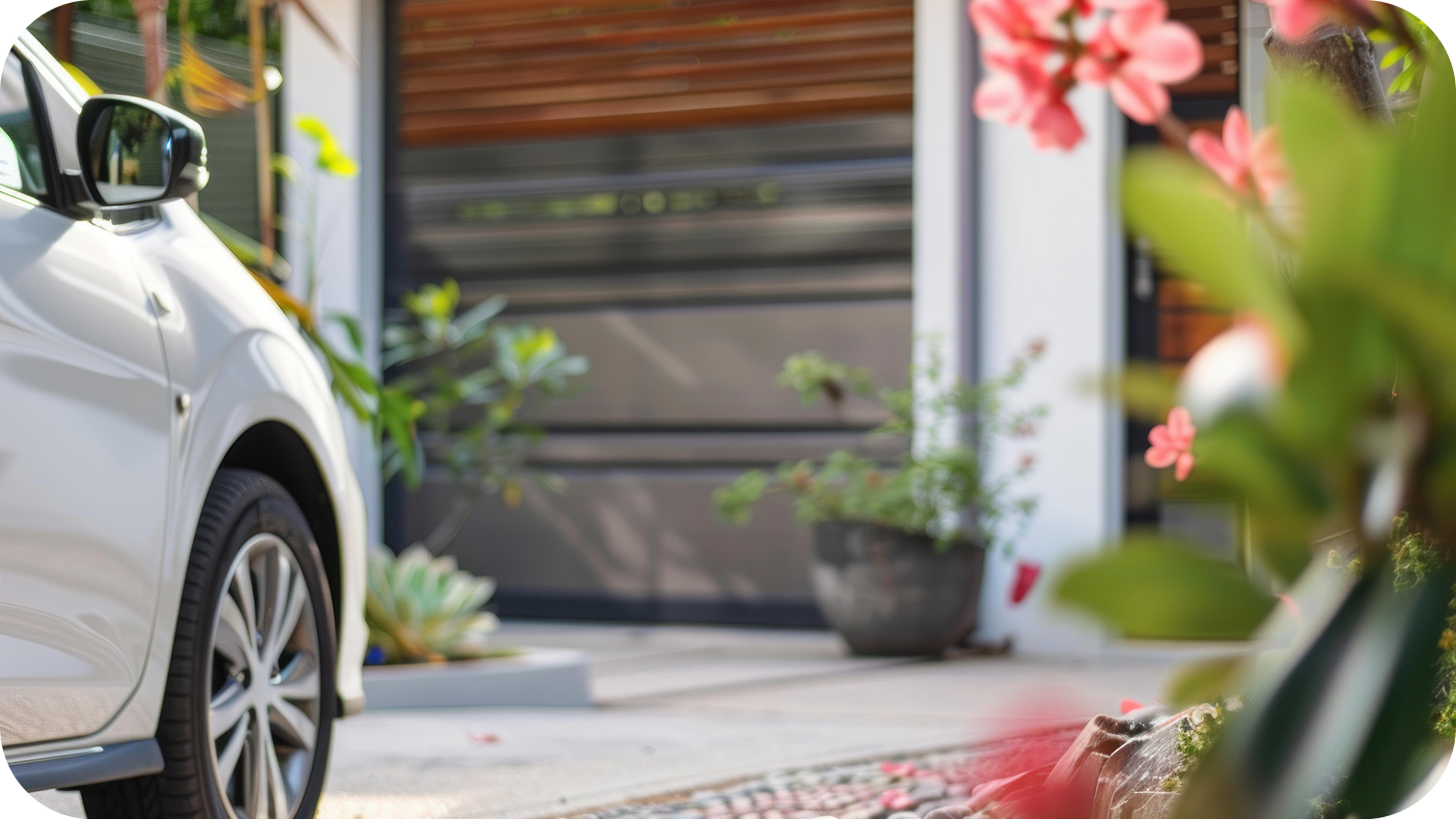 the front of a Chevy car pulling in front of a garage door
