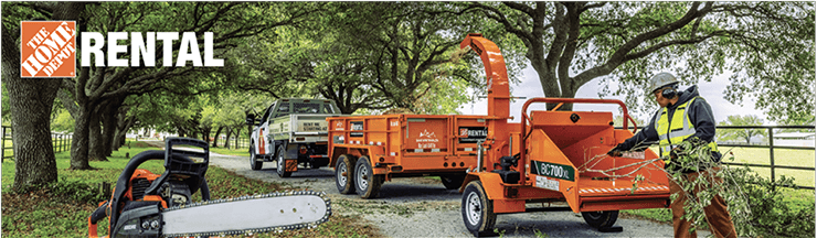 A Home Depot rental truck with a trailer and wood chipper with a chainsaw