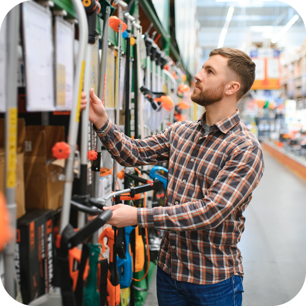 A person shopping for a weedwacker