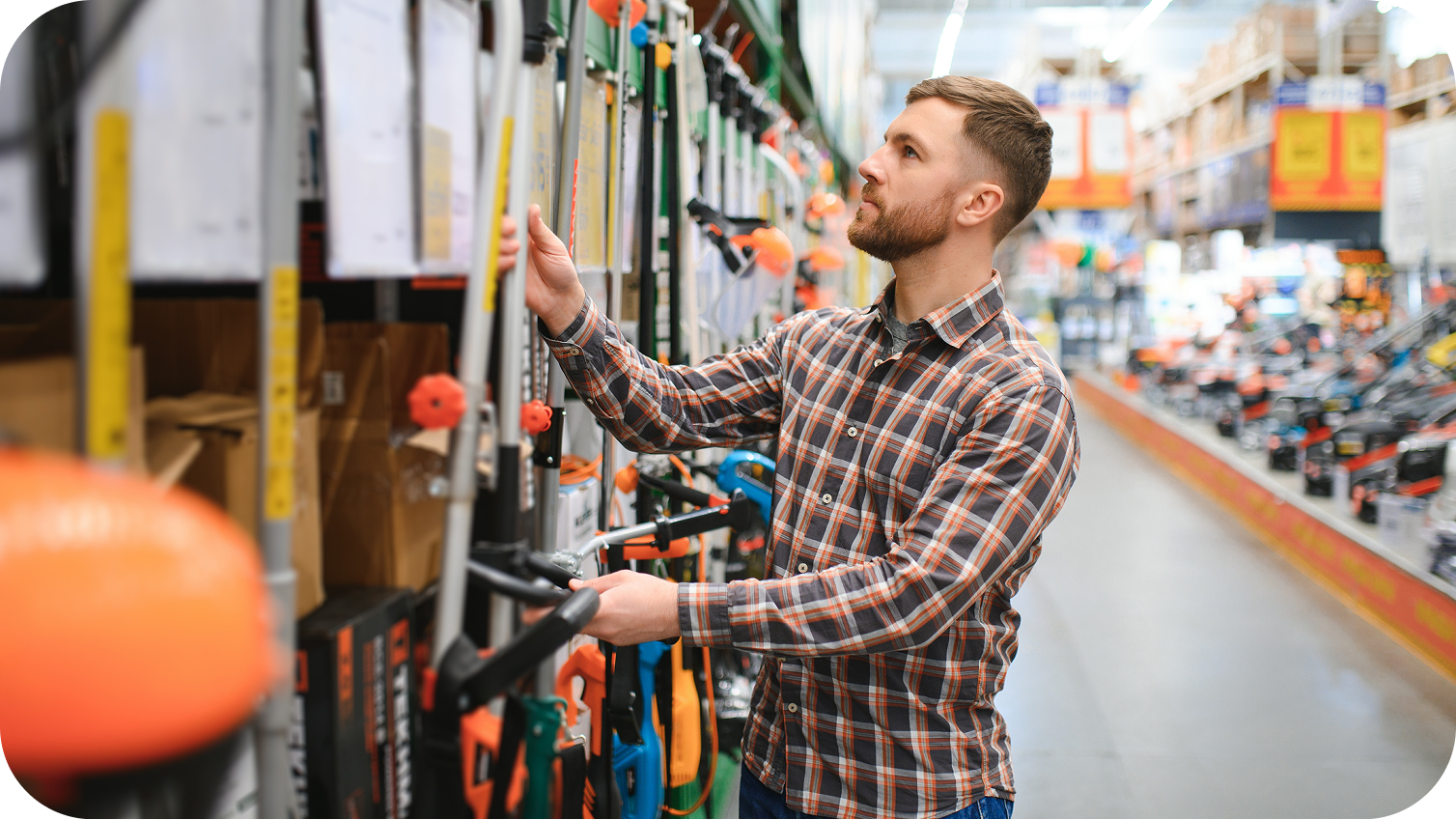 A person shopping for a weedwacker