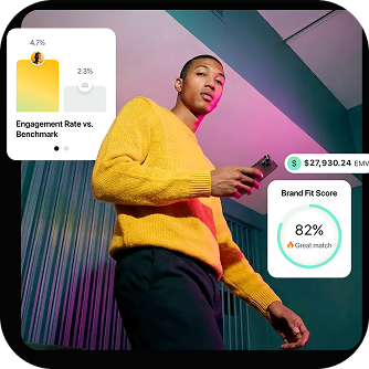 A person holding a mobile phone looking at charts
