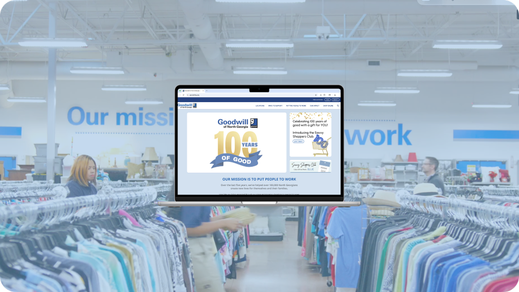 An opened laptop in a Goodwill of North Georgia store. Laptop has Goodwill of North Georgia website in the browser.